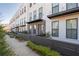 Charming townhome exteriors featuring brick accents and fenced front patios create curb appeal at 852 Constellation Dr, Decatur, GA 30033