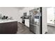 Modern kitchen featuring stainless steel appliances, white cabinets, and a granite countertop island at 852 Constellation Dr, Decatur, GA 30033
