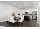Open concept kitchen featuring white cabinets, stainless steel appliances, and a center island at 852 Constellation Dr, Decatur, GA 30033