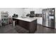 Bright kitchen with a large island, modern appliances, and ample storage in the cabinets at 852 Constellation Dr, Decatur, GA 30033