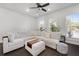 Bright living room showcases a large white sectional sofa, hardwood floors, and recessed lighting at 852 Constellation Dr, Decatur, GA 30033