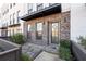 Cozy front patio with stone pavers and a privacy fence is perfect for relaxing outdoors at 852 Constellation Dr, Decatur, GA 30033
