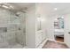 Modern bathroom featuring a glass enclosed shower, marble tile and double vanity at 1054 Foreststone Sw Way, Marietta, GA 30064