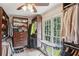 Well-organized closet with custom shelving, drawers, and an ironing board at 1054 Foreststone Sw Way, Marietta, GA 30064