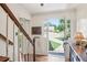 Bright foyer with hardwood floors, staircase, and view of the front yard at 1054 Foreststone Sw Way, Marietta, GA 30064