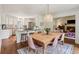 Open concept kitchen and dining area featuring stainless steel appliances and hardwood floors at 1054 Foreststone Sw Way, Marietta, GA 30064