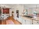 Stylish kitchen with stainless appliances, granite counters, and adjacent breakfast area at 1054 Foreststone Sw Way, Marietta, GA 30064