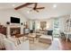 Cozy living room with fireplace, vaulted ceilings, and comfortable seating at 1054 Foreststone Sw Way, Marietta, GA 30064