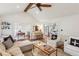 Spacious living room with hardwood floors, natural light, and views of the kitchen and dining areas at 1054 Foreststone Sw Way, Marietta, GA 30064