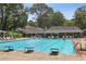 Community pool with lounge chairs and shaded areas for residents to relax and enjoy at 1054 Foreststone Sw Way, Marietta, GA 30064