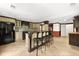 Finished basement bar with tiled flooring, seating, and stainless steel appliances at 3260 Governors Court Ct, Duluth, GA 30096