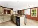 Finished basement bar with stainless steel appliances, tiled floors and a large window at 3260 Governors Court Ct, Duluth, GA 30096