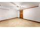 Unfinished basement room with tiled floors, a wooden door and wood trim throughout at 3260 Governors Court Ct, Duluth, GA 30096