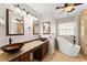 Elegant bathroom with a soaking tub, granite countertops and double vanity sinks at 3260 Governors Court Ct, Duluth, GA 30096