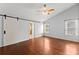 Spacious bedroom with a vaulted ceiling, ceiling fan and sliding barn door at 3260 Governors Court Ct, Duluth, GA 30096