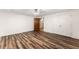 A bedroom featuring new flooring, ceiling fan, closet, and open door at 3260 Governors Court Ct, Duluth, GA 30096