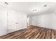 A bright bedroom with new floors, closet, new ceiling light, and door at 3260 Governors Court Ct, Duluth, GA 30096