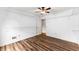Bedroom with hardwood floors, a ceiling fan, and open shelving for ample storage space at 3260 Governors Court Ct, Duluth, GA 30096