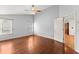Bright bedroom with hardwood floors, a ceiling fan and access to another room at 3260 Governors Court Ct, Duluth, GA 30096