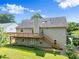 Back exterior of the house featuring a deck and stairs at 3260 Governors Court Ct, Duluth, GA 30096
