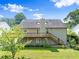 View of the back of the home showing the large deck and covered outdoor area at 3260 Governors Court Ct, Duluth, GA 30096