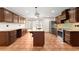 Well-appointed kitchen with large island, stainless appliances, and custom cabinetry at 3260 Governors Court Ct, Duluth, GA 30096