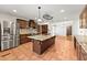 Spacious kitchen featuring a large island with granite countertops, wood cabinets and stainless steel appliances at 3260 Governors Court Ct, Duluth, GA 30096