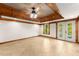 Spacious living room with decorative wood ceiling, tiled floors, recessed lighting and natural light at 3260 Governors Court Ct, Duluth, GA 30096