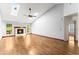 Bright living room featuring skylights, hardwood floors, and a cozy fireplace at 3260 Governors Court Ct, Duluth, GA 30096