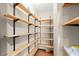 Pantry with custom wood shelving for maximum storage at 3260 Governors Court Ct, Duluth, GA 30096
