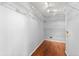 Walk-in closet with hardwood flooring and open shelving ready for storage at 3260 Governors Court Ct, Duluth, GA 30096