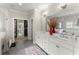 Bright bathroom boasts a double vanity, walk-in shower, and access to the walk-in closet at 109 Bellehaven Dr, Woodstock, GA 30188