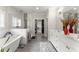 Bright bathroom features a soaking tub, walk-in shower, double vanity, and a walk-in closet at 109 Bellehaven Dr, Woodstock, GA 30188