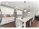 Well-equipped kitchen featuring a center island with bar seating, white cabinets, and modern appliances at 109 Bellehaven Dr, Woodstock, GA 30188