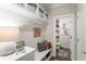 Cozy mudroom featuring a bench, storage hooks, and decorative accents next to a half-bathroom at 109 Bellehaven Dr, Woodstock, GA 30188