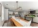 Open-concept space featuring a dining area, kitchen, and living room with fireplace and large sliding glass doors at 109 Bellehaven Dr, Woodstock, GA 30188