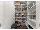 Well-organized pantry with custom shelving offering ample storage for food and kitchen essentials at 109 Bellehaven Dr, Woodstock, GA 30188