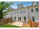 Townhome exterior with a small yard, patio, and fenced in backyard at 2058 Glenview Park Cir, Duluth, GA 30097