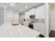 Bright kitchen featuring white cabinets, stainless steel appliances, and stone countertops at 2058 Glenview Park Cir, Duluth, GA 30097