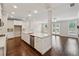 Open-concept kitchen with stainless steel appliances, a large island, and hardwood floors at 2058 Glenview Park Cir, Duluth, GA 30097