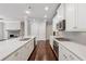 Modern kitchen featuring white cabinets, stainless steel appliances, stone countertops, and a gas stove at 2058 Glenview Park Cir, Duluth, GA 30097