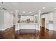 Open living room featuring hardwood floors, recessed lighting, and open access to the kitchen at 2058 Glenview Park Cir, Duluth, GA 30097