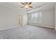 Large main bedroom with tray ceiling and large windows providing ample natural light at 2058 Glenview Park Cir, Duluth, GA 30097