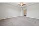 Spacious main bedroom featuring neutral paint, plush carpet, and an open door to the main bath at 2058 Glenview Park Cir, Duluth, GA 30097