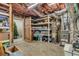 Unfinished basement with ample storage space, shelving, and utility equipment like a water heater at 7125 Heard Rd, Cumming, GA 30041
