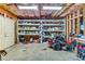 Spacious unfinished basement with organized storage shelves and ample room for various equipment and tools at 7125 Heard Rd, Cumming, GA 30041