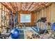 Unfinished basement converted into a home gym with exercise equipment and natural light from a window at 7125 Heard Rd, Cumming, GA 30041