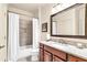 Bathroom featuring neutral tile work, a shower with curtain, and granite countertops at 7125 Heard Rd, Cumming, GA 30041