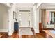 Bright foyer with hardwood floors, neutral walls, and stylish decor at 7125 Heard Rd, Cumming, GA 30041