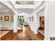 Grand foyer with hardwood floors, soaring ceilings, and elegant trim at 7125 Heard Rd, Cumming, GA 30041